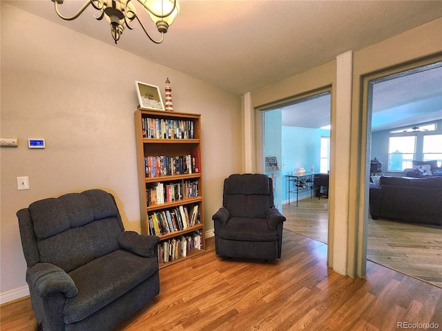 160 Shannon Ct, Rockvale, CO 81244 - living area featuring wood finished floors, a chandelier, and lofted ceiling