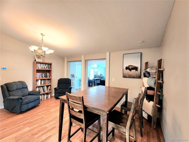 160 Shannon Ct, Rockvale, CO 81244 - dining space with light wood-style flooring and a chandelier