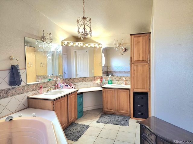 160 Shannon Ct, Rockvale, CO 81244 - full bathroom with a chandelier, a garden tub, vanity, tile patterned flooring, and a textured wall