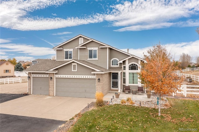 view of front of house featuring a garage and a front yard