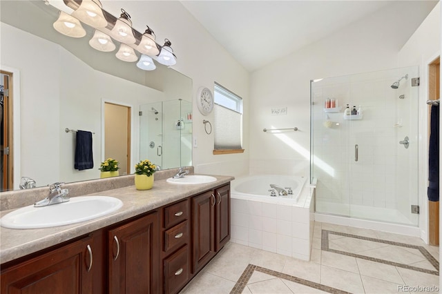 bathroom featuring independent shower and bath, vanity, lofted ceiling, and tile patterned flooring