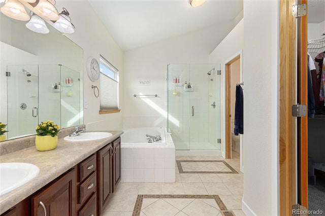 bathroom with lofted ceiling, shower with separate bathtub, tile patterned flooring, and vanity