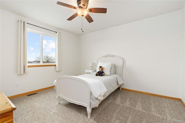 carpeted bedroom with ceiling fan