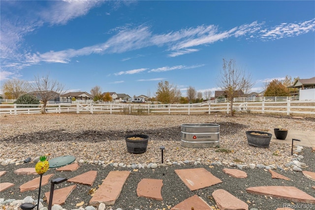 view of yard with a rural view