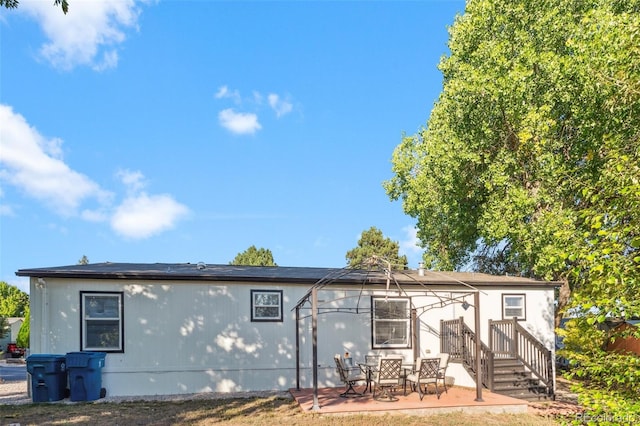 back of property featuring a patio area