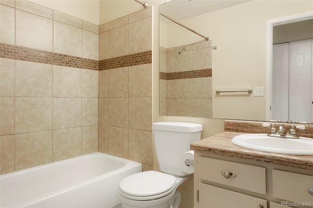 full bath featuring toilet, shower / bathtub combination, and vanity