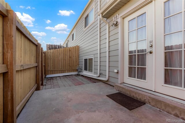 view of patio / terrace featuring fence