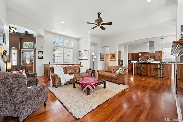 4944 W 107th Loop, Westminster, CO 80031 - living room featuring a ceiling fan, dark wood-type flooring, arched walkways, and recessed lighting