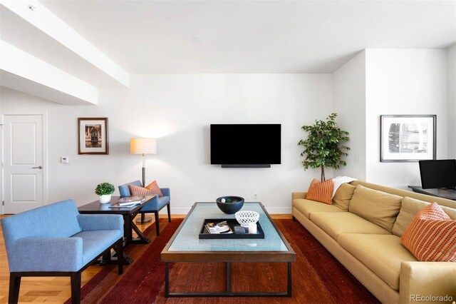 2001 Lincoln St Unit 1723, Denver, CO 80202 - living room with dark wood-type flooring and baseboards