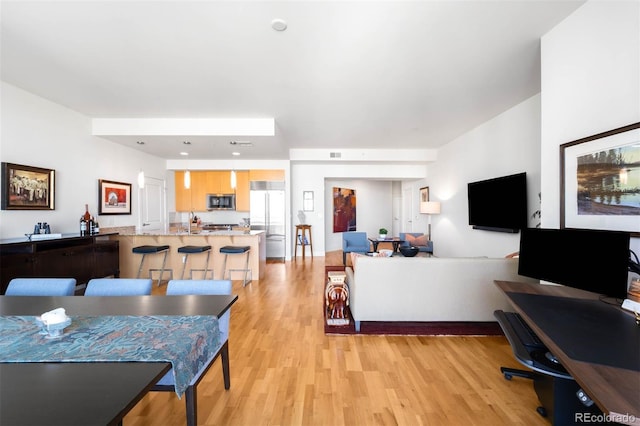 2001 Lincoln St Unit 1723, Denver, CO 80202 - living area with light wood-type flooring and a desk