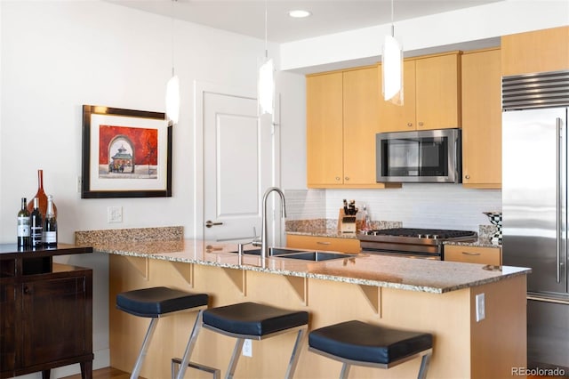 2001 Lincoln St Unit 1723, Denver, CO 80202 - kitchen with appliances with stainless steel finishes, light brown cabinetry, backsplash, light stone countertops, and recessed lighting