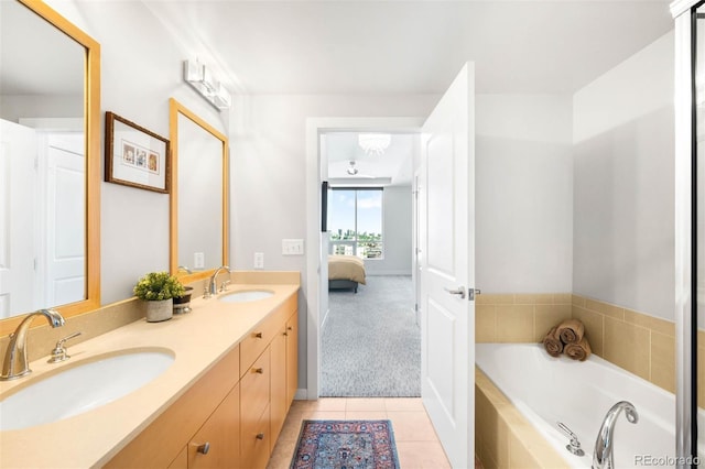 2001 Lincoln St Unit 1723, Denver, CO 80202 - bathroom featuring double vanity, tile patterned flooring, a bath, and ensuite bath