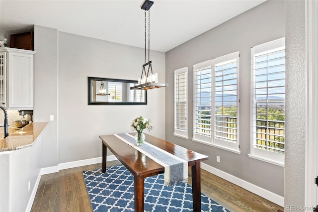 444 Pasada Way, Monument, CO 80132 - dining area with dark wood-style floors and baseboards