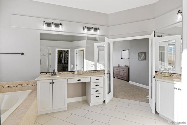 444 Pasada Way, Monument, CO 80132 - bathroom with a bath, two vanities, a stall shower, and tile patterned flooring
