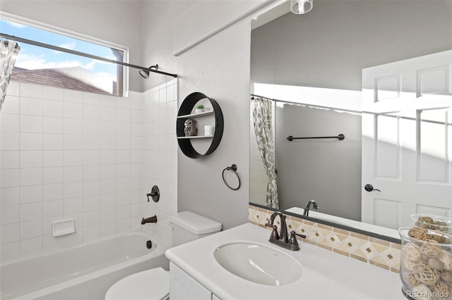 444 Pasada Way, Monument, CO 80132 - full bathroom featuring vanity, shower / bath combo with shower curtain, and toilet