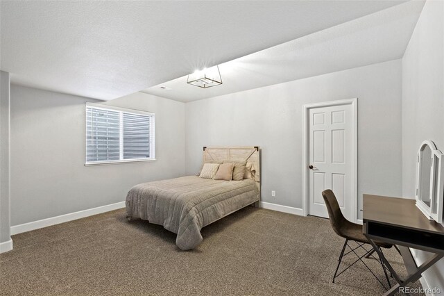 444 Pasada Way, Monument, CO 80132 - carpeted bedroom featuring baseboards