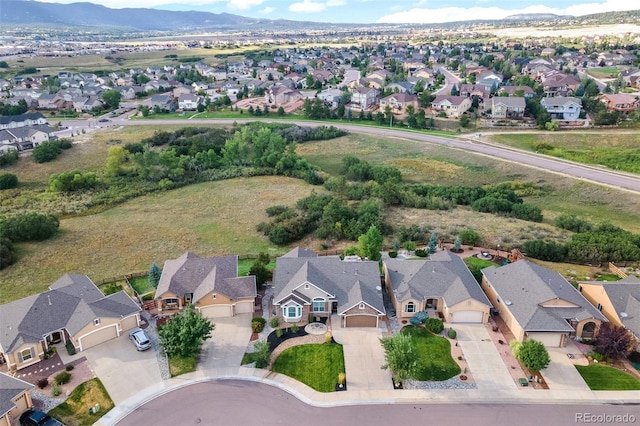 444 Pasada Way, Monument, CO 80132 - aerial overview of property's location with nearby suburban area and a mountainous background