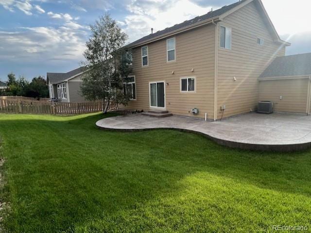 rear view of house with a patio, central AC, and entry steps