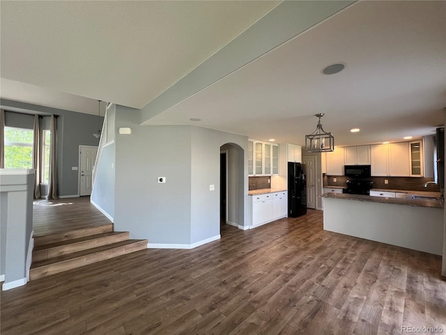 5414 Brookline Dr, Timnath, CO 80547 - kitchen featuring black appliances, baseboards, white cabinets, and recessed lighting