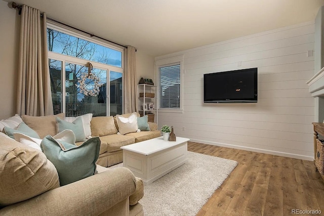 5414 Brookline Dr, Timnath, CO 80547 - living room with light wood-style flooring and wood walls