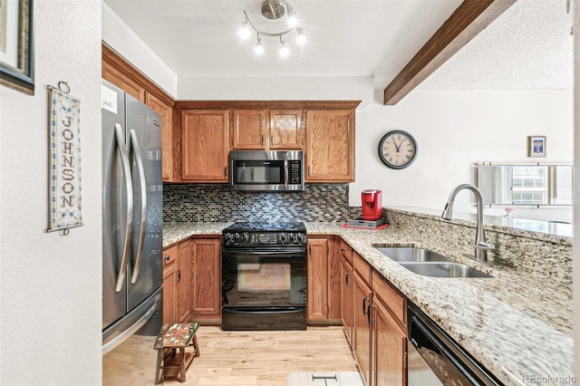1950 S Helena St Unit D, Aurora, CO 80013 - kitchen with appliances with stainless steel finishes, a sink, light wood finished floors, decorative backsplash, and light stone counters
