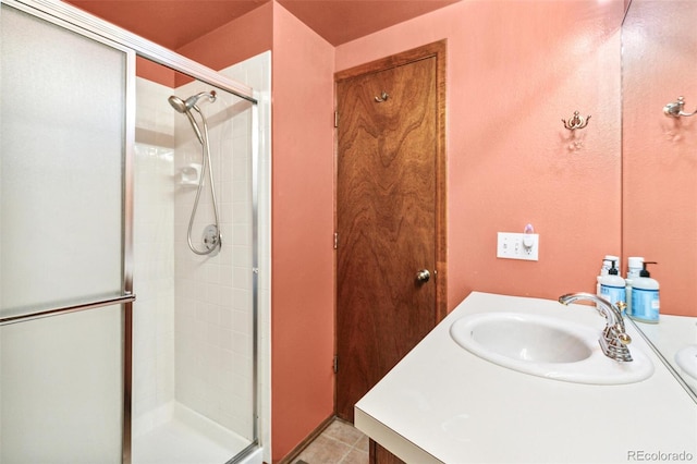 1950 S Helena St Unit D, Aurora, CO 80013 - full bath with a shower stall, vanity, and tile patterned flooring