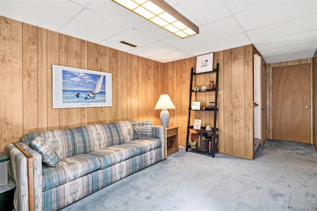 1950 S Helena St Unit D, Aurora, CO 80013 - carpeted living area featuring a drop ceiling and wood walls