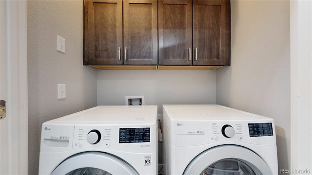 8742 E 47th Ave, Denver, CO 80238 - laundry area featuring washing machine and clothes dryer and cabinet space