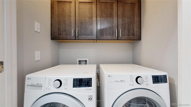 8742 E 47th Ave, Denver, CO 80238 - laundry area with washer and dryer and cabinet space