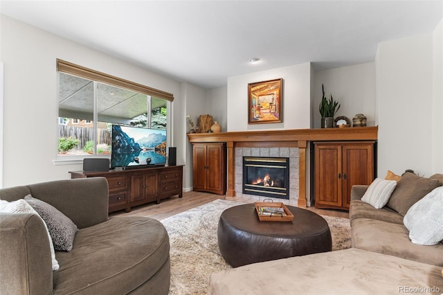 6643 Orion Ct, Arvada, CO 80007 - living room featuring wood finished floors and a fireplace