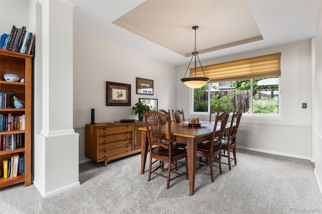 6643 Orion Ct, Arvada, CO 80007 - dining area with light carpet and a tray ceiling