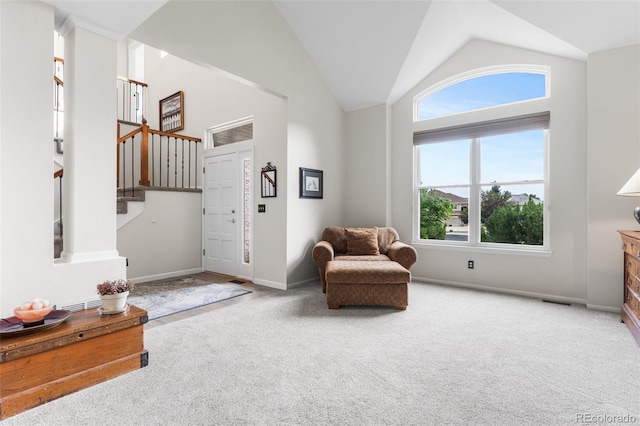 6643 Orion Ct, Arvada, CO 80007 - living area with carpet, stairs, and vaulted ceiling