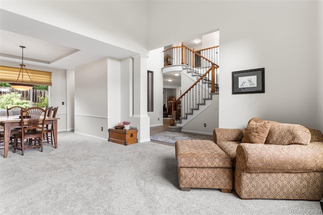 6643 Orion Ct, Arvada, CO 80007 - carpeted living room with baseboards and stairway