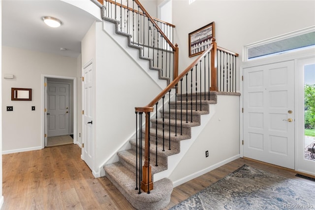 6643 Orion Ct, Arvada, CO 80007 - foyer entrance with wood finished floors and stairway