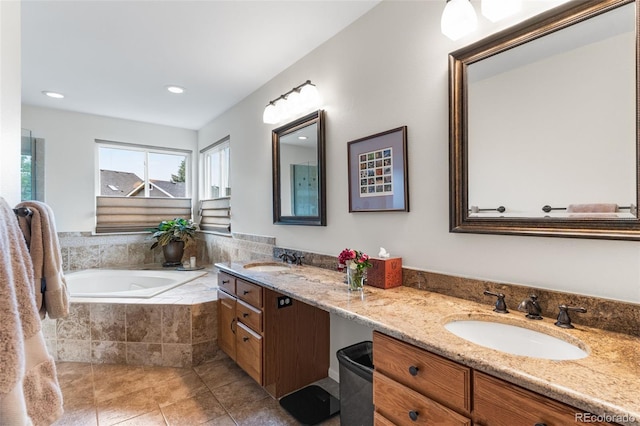 6643 Orion Ct, Arvada, CO 80007 - bathroom featuring double vanity, tile patterned floors, a bath, and recessed lighting