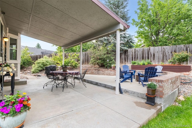 6643 Orion Ct, Arvada, CO 80007 - fenced backyard with outdoor dining space and a patio area