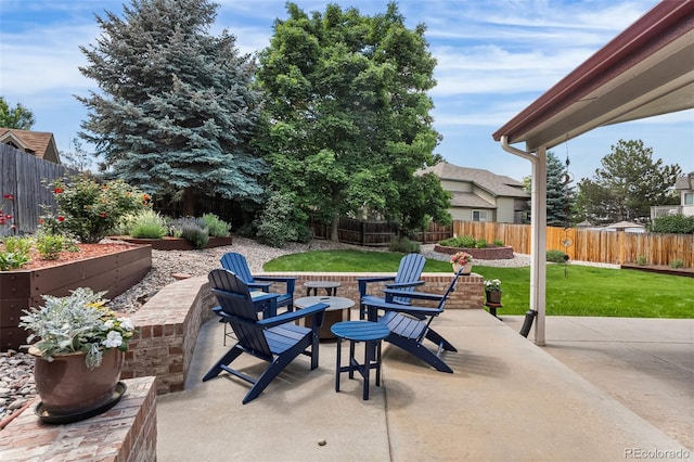 6643 Orion Ct, Arvada, CO 80007 - fenced backyard featuring a patio area and an outdoor fire pit