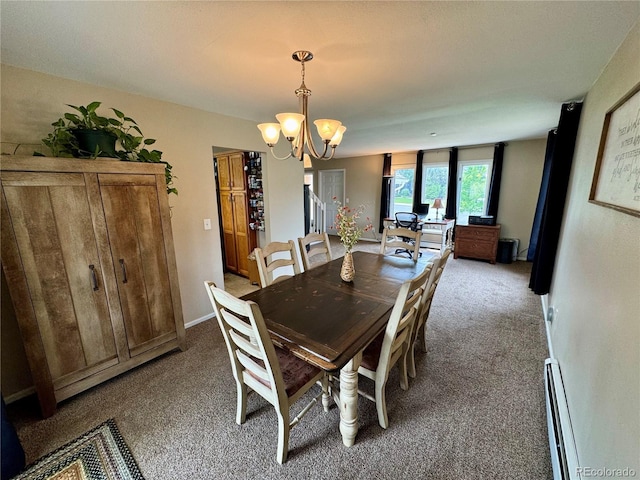 4949 W 13th St, Greeley, CO 80634 - carpeted dining space with a baseboard heating unit and a chandelier