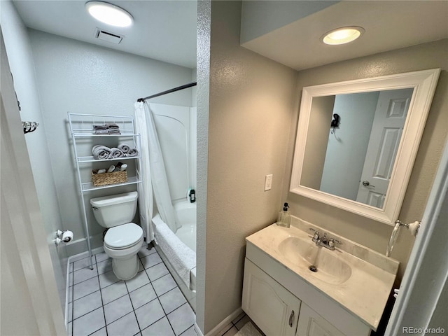4949 W 13th St, Greeley, CO 80634 - bathroom with toilet, vanity, tile patterned floors, shower / tub combo with curtain, and a textured wall