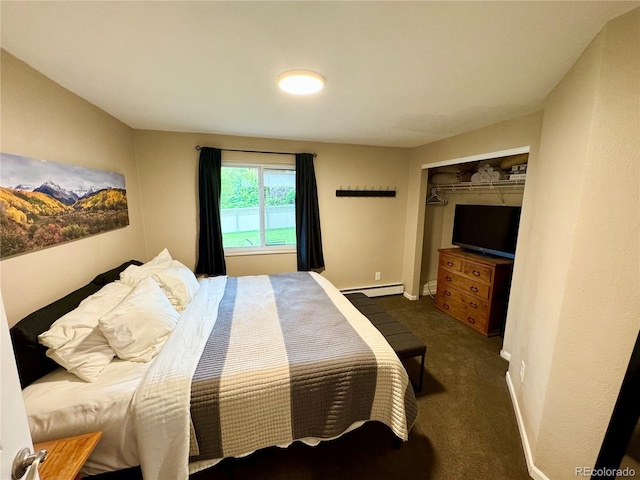 4949 W 13th St, Greeley, CO 80634 - bedroom with carpet flooring, a closet, a baseboard radiator, and baseboards