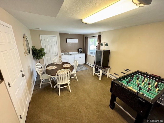 4949 W 13th St, Greeley, CO 80634 - dining room featuring carpet flooring, baseboards, and a textured ceiling