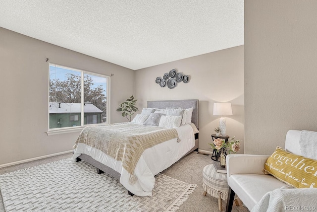 carpeted bedroom with a textured ceiling