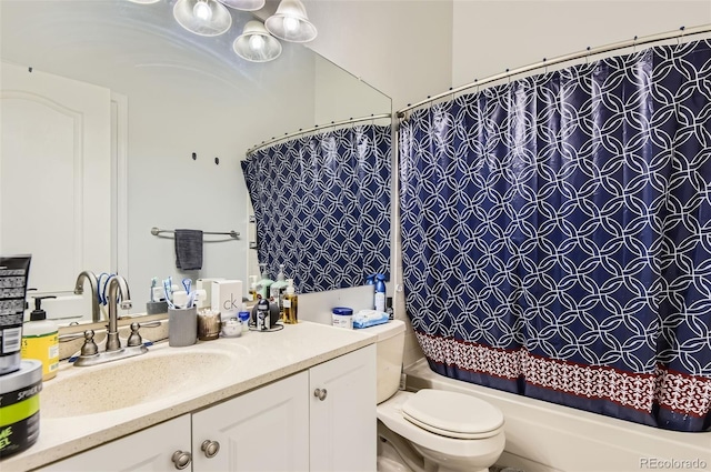 full bath with vanity, shower / bath combo, and toilet