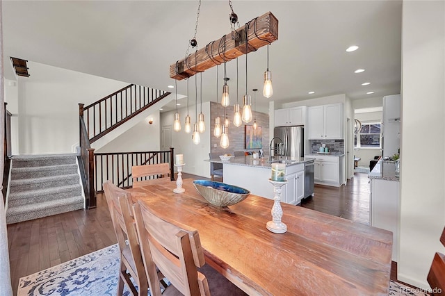 dining area featuring dark hardwood / wood-style floors