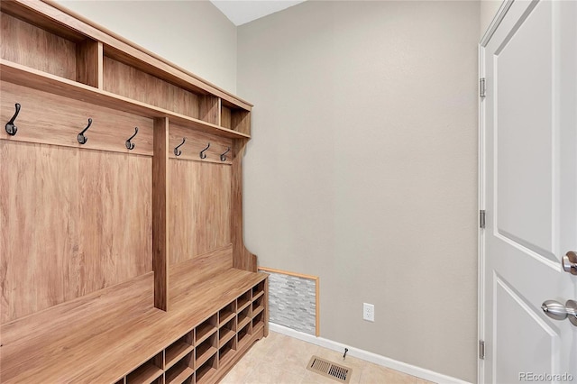 mudroom with light tile patterned floors