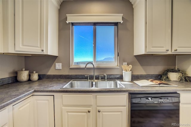 kitchen with dark countertops, dishwasher, white cabinetry, and a sink