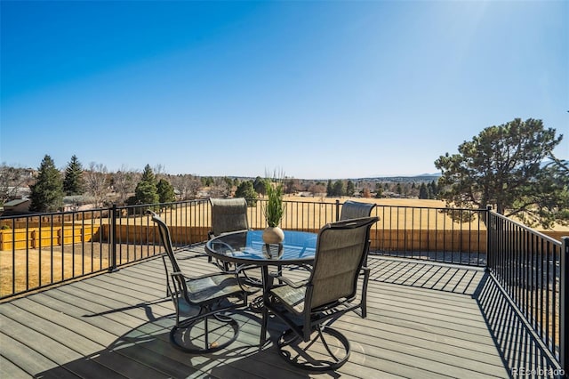 wooden deck featuring outdoor dining space