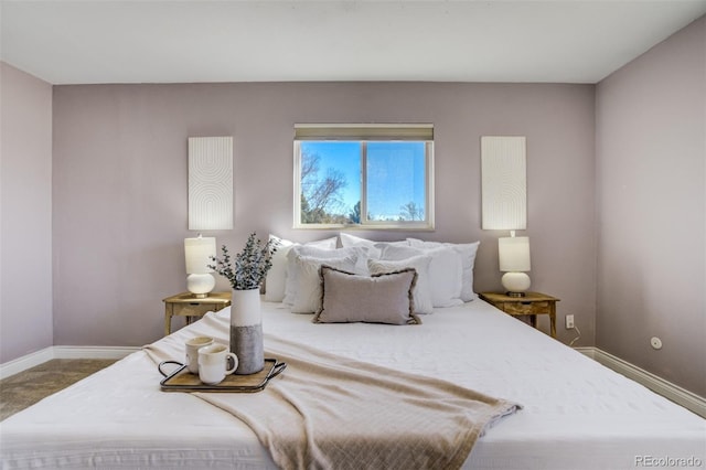 bedroom with carpet flooring and baseboards