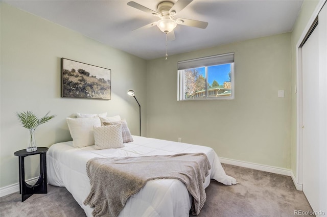 bedroom featuring a closet, ceiling fan, baseboards, and carpet floors