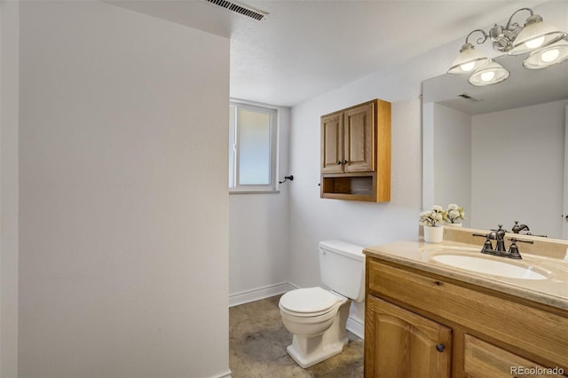 bathroom featuring visible vents, baseboards, toilet, and vanity